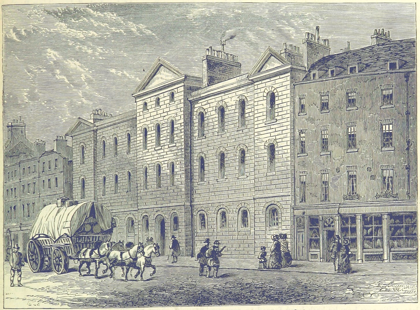 An engraving of an imposing brick building with numerous windows. In the street below, people in Victorian dress walk by. A covered waggon drawn by four horses is proceeding along the road.