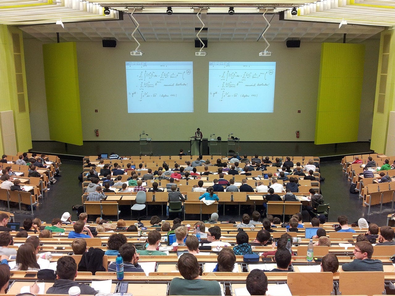 large auditorium style lecture hall with students