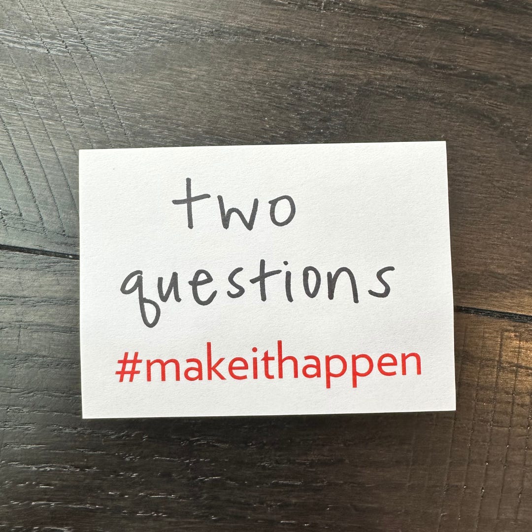 a photo of a sticky note that has, “two questions” written on it and includes #makeithappen preprinted on the bottom