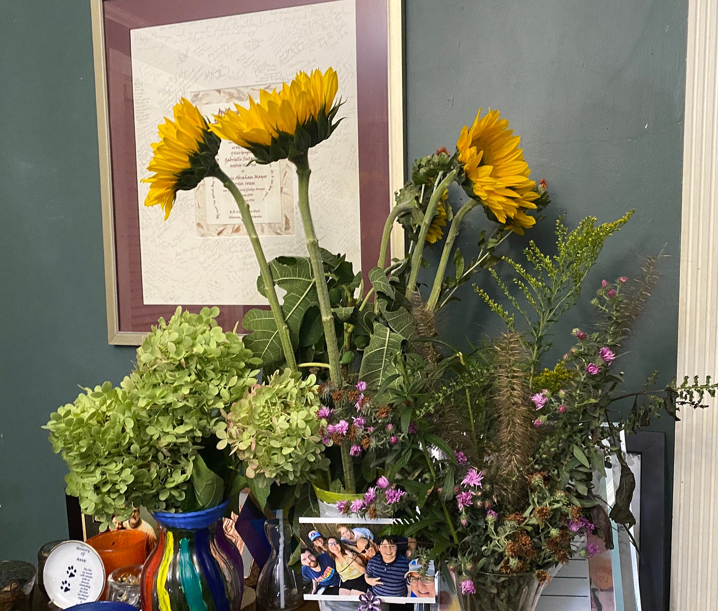 vases of sun flowers and azaleas