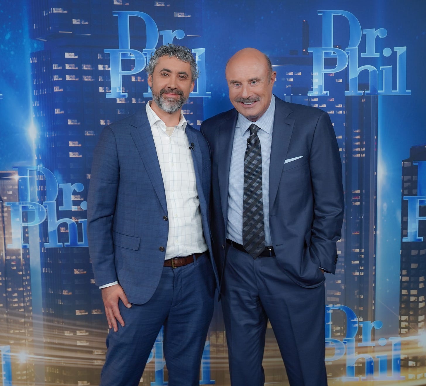 Image of Andrew Hartz and Dr. Phil on set