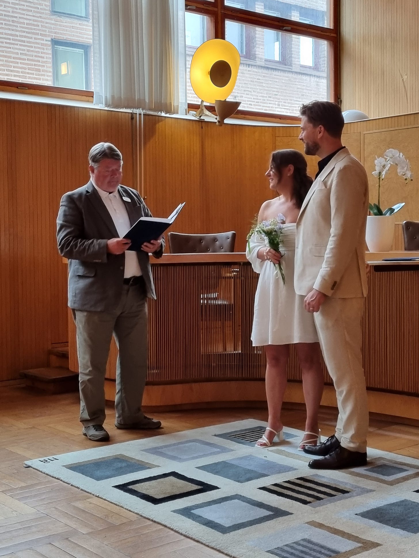 Photo of Louis and Lauren during the ceremony with the celebrant.