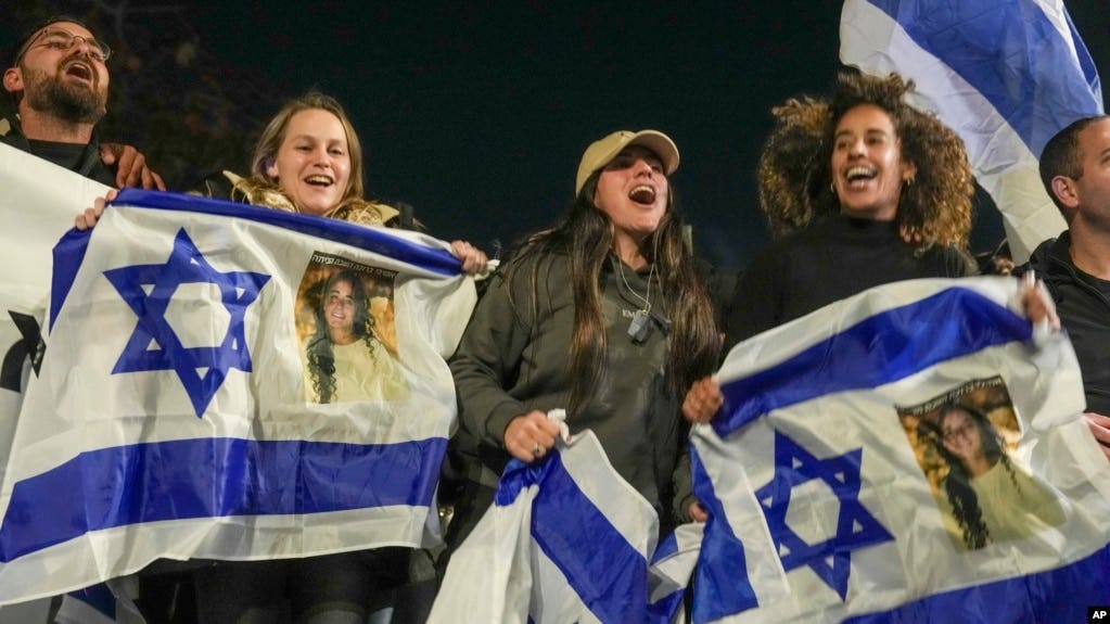 Israelis celebrate the release of three hostages who had been held captive by Hamas in Gaza, in Tel Aviv, Israel, Jan. 19, 2025.