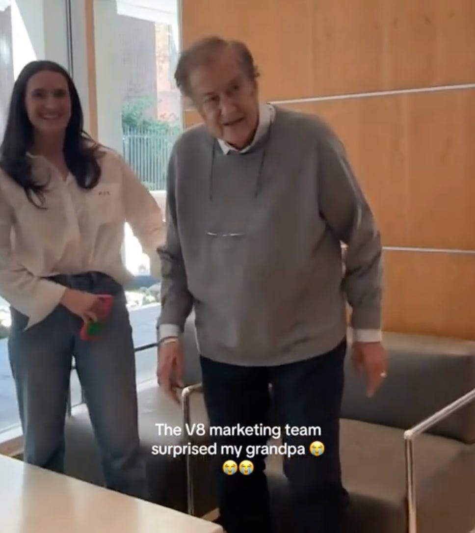 Screenshot of a 92 year old grandpa and his granddaughter. The text says "The V8 marketing team surprised my grandpa"