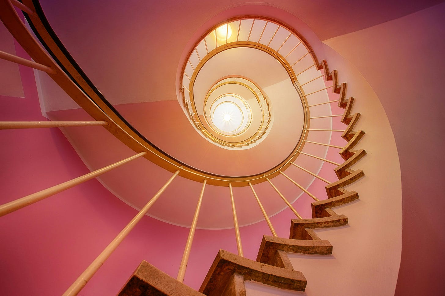 Looking up the center of a spiral staircase. Looking up the center of a spiral staircase.
