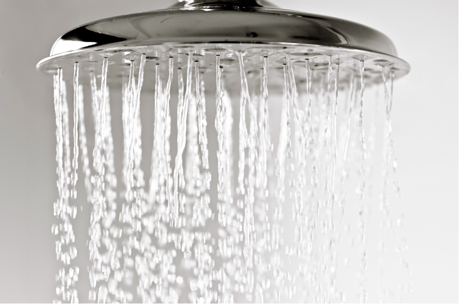 a shower head with running water