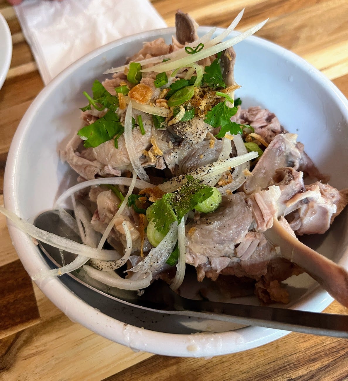 Bowl of broth bones with garnish