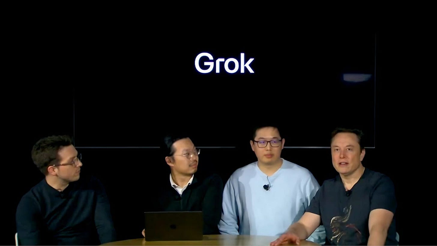 Members of the xAI team, including Musk (far right), during a live-streamed presentation of Grok 3.