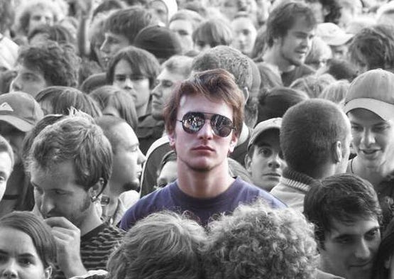 A person standing in a crowd

AI-generated content may be incorrect.