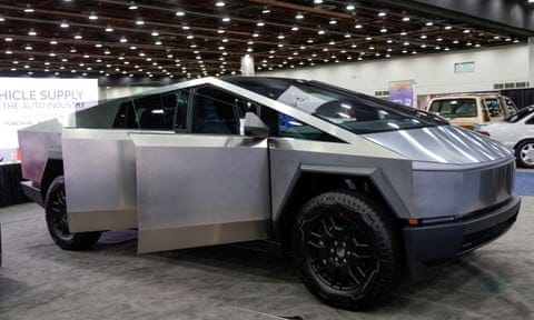 A Tesla Cybertruck, a silver chunky car