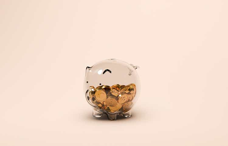 Glass Piggy Bank With Gold Dollar Coins