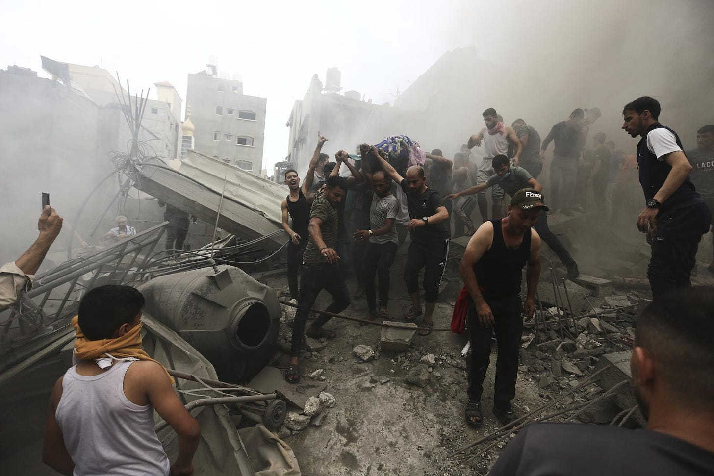 Palestinians remove a body from the rubble after an Israeli airstrike on Gaza’s Jebaliya refugee camp on Monday.