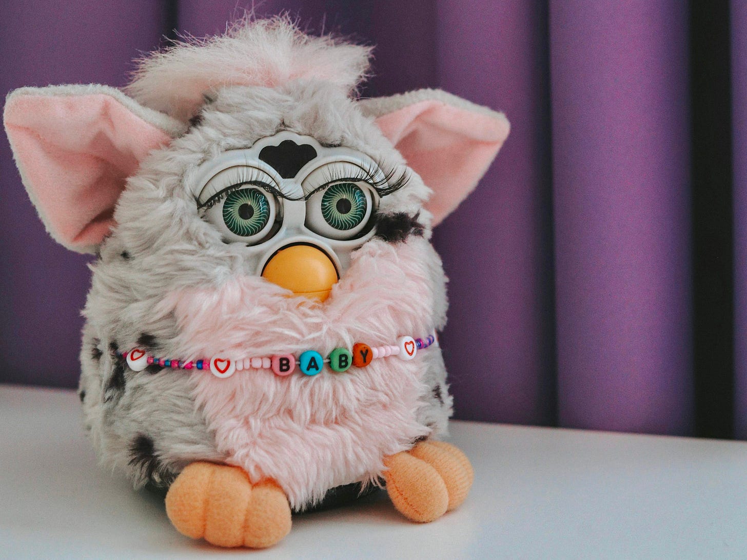 a stuffed animal is sitting on a table