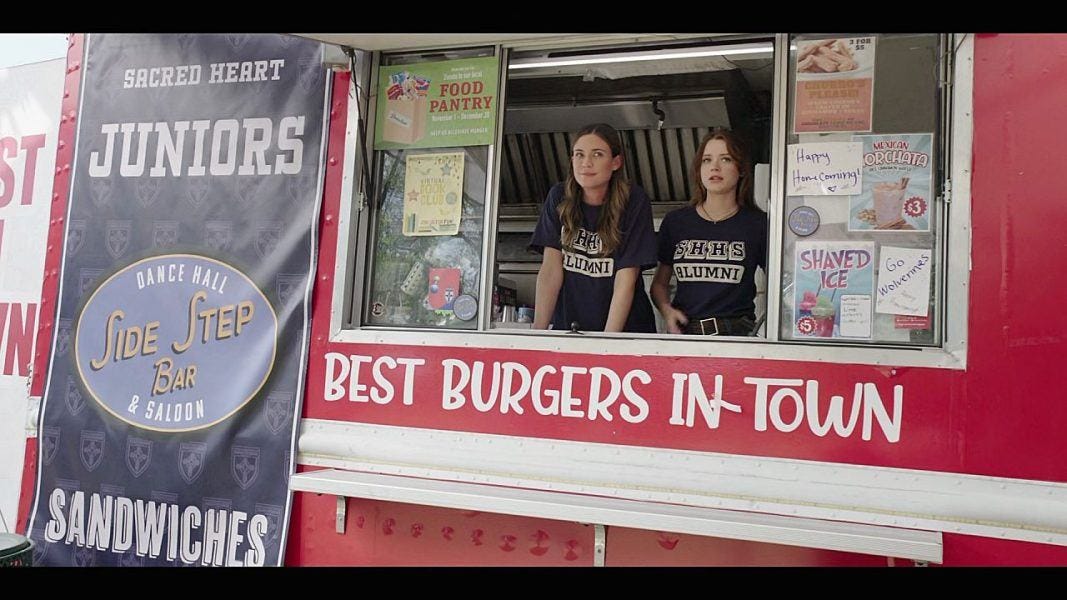 Walker STella helping Geri with her food truck at high school football game.