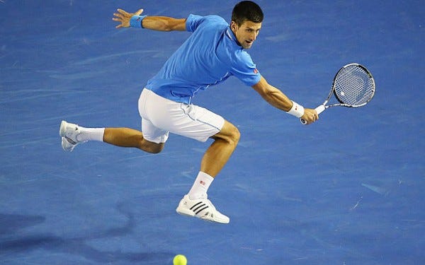 novak djokovic jumps for stan wwawrinka balls at australian open 2015