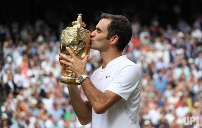Roger Federer celebrates Wimbledon victory