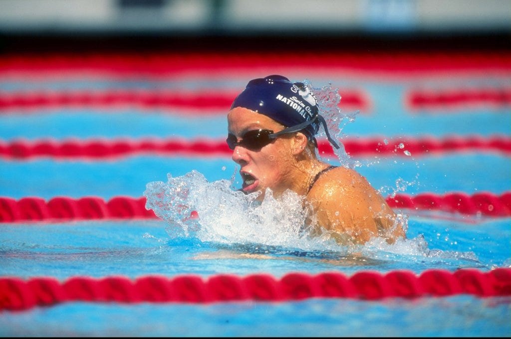 Jamie Cail pictured swimming at a swim meet.