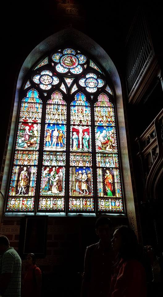 A stained glass window viewed from the interior