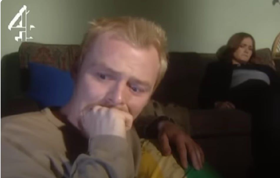 Tim from Spaced aka Simon Pegg pulls a deep cringe fist in mouth face after Daisy recounts her girl power salute interview story