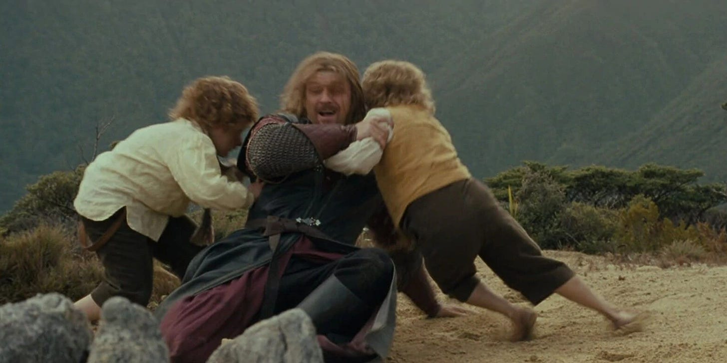 Boromir being tackled by the hobbits