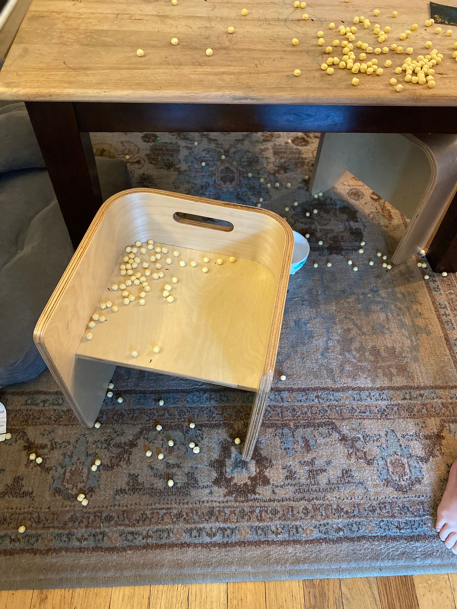 cereal on table, stool and floor