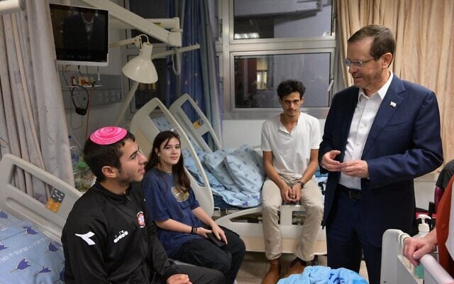Illustrative: President Isaac Herzog visits wounded soldiers at Ichilov Hospital in Tel Aviv on November 8, 2023. (Amos Ben Gershom/GPO) Illustrative: President Isaac Herzog visits wounded soldiers at Ichilov Hospital in Tel Aviv on November 8, 2023. (Amos Ben Gershom/GPO)