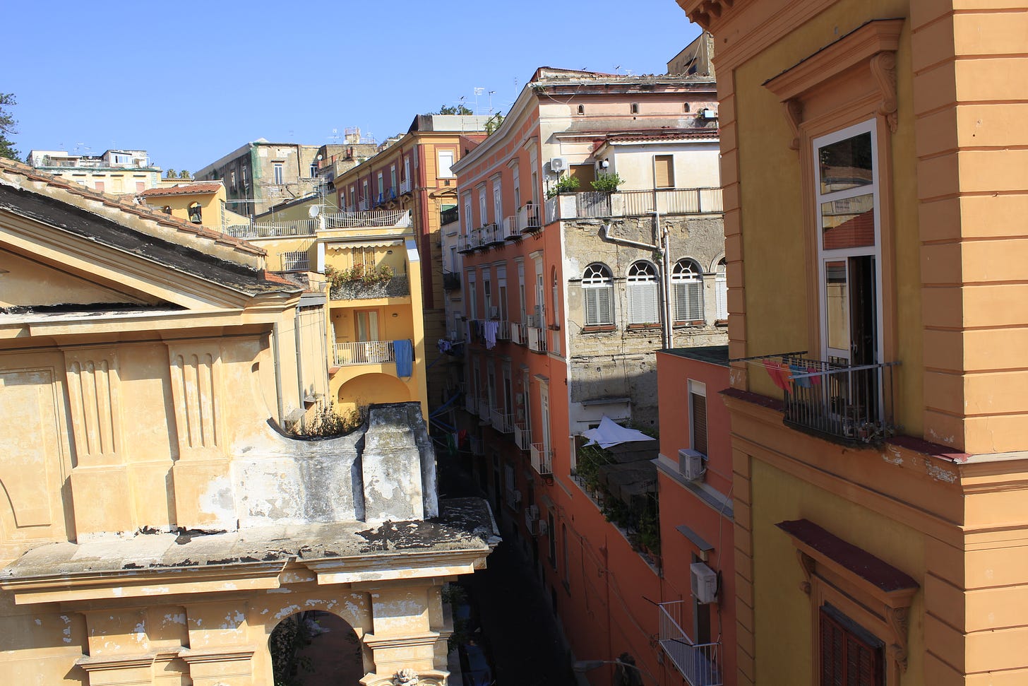 a view of colorful buildings in a Naples neighborhood