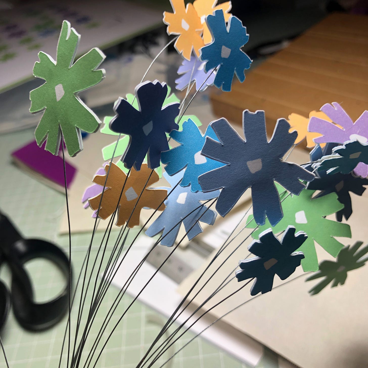 collection of spring paper flowers on wires