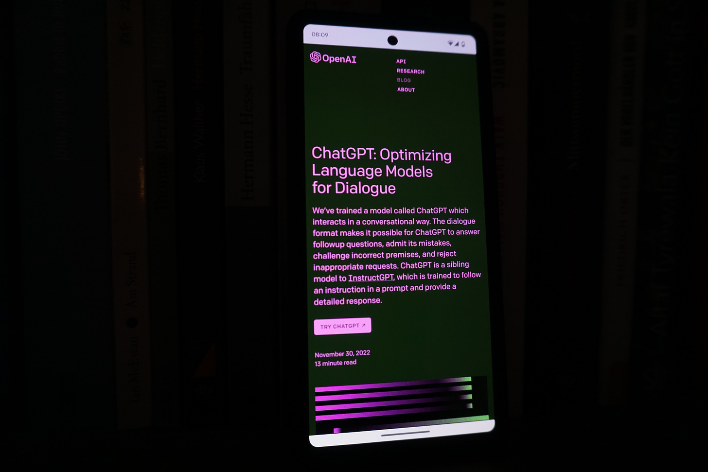 An image of a mobile phone with the ChatGPT site open