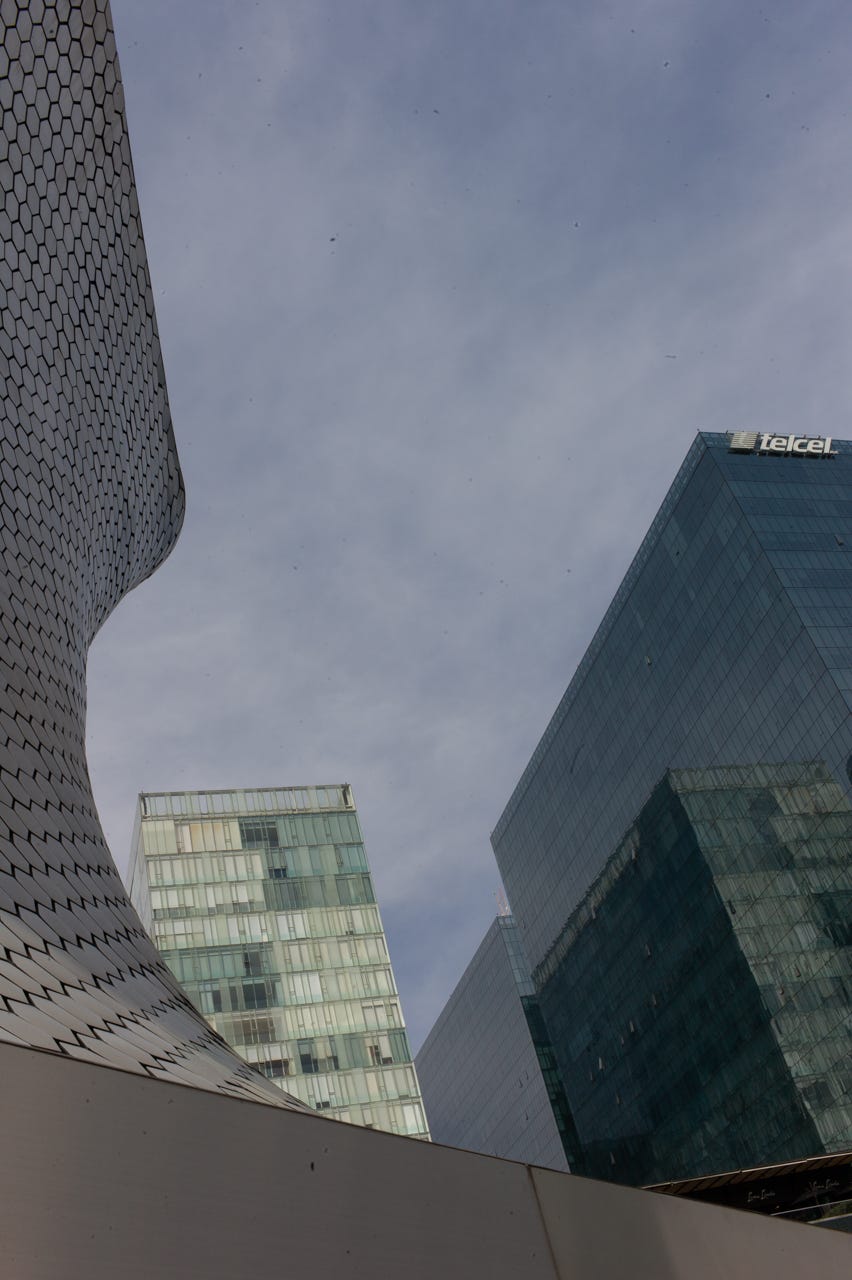 Low angle view of tall buildings

Description automatically generated