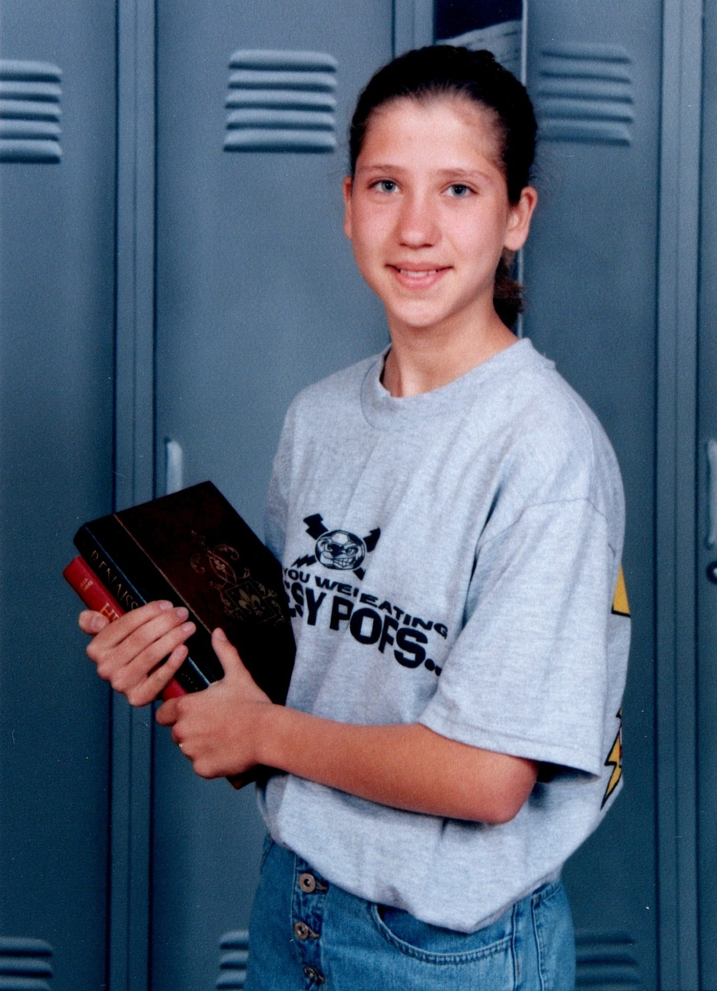 Junior high class photo. I'm in a gray tshirt and jeans holding books