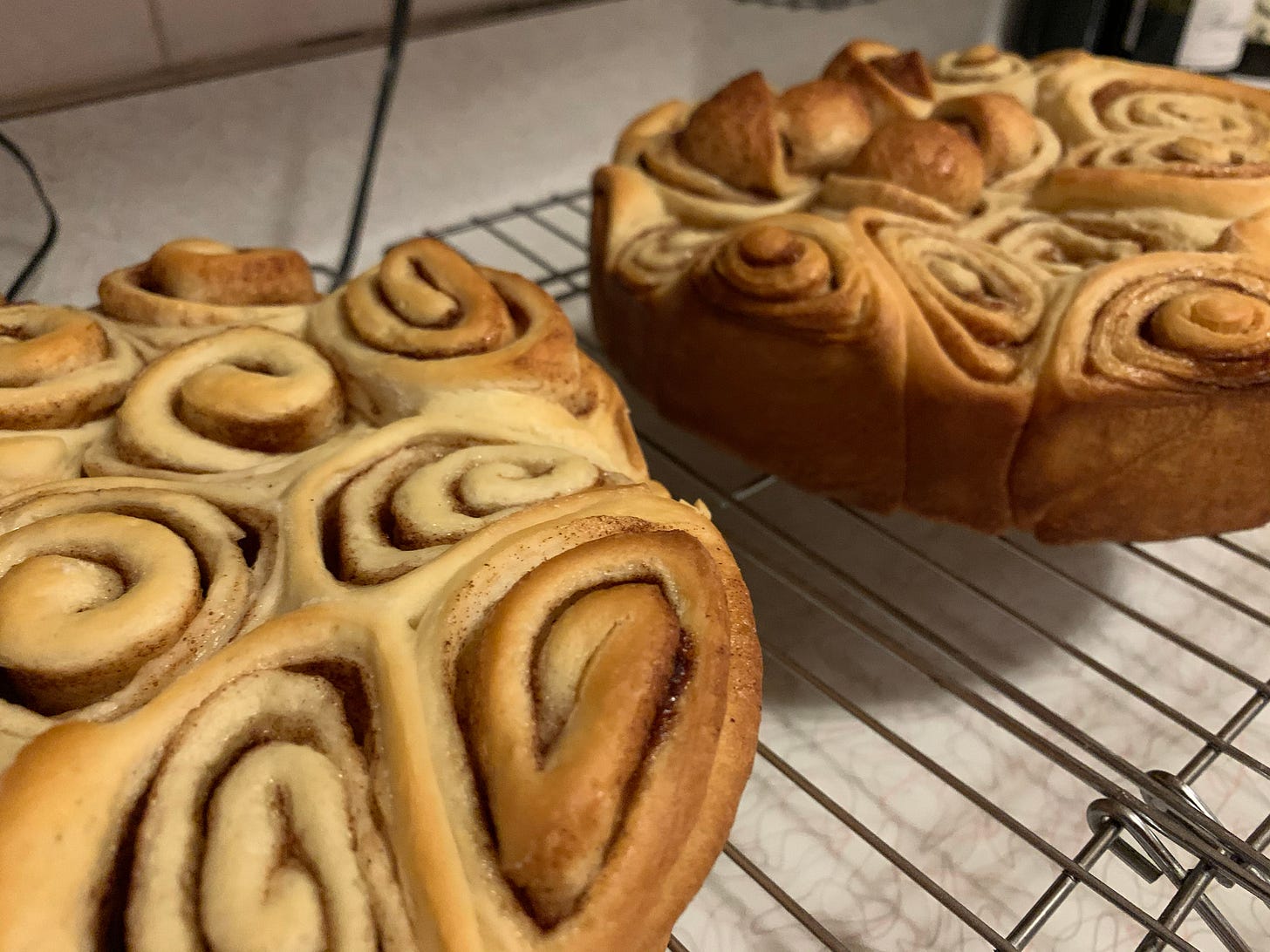 An image of two rounds of un-iced cinnamon rolls
