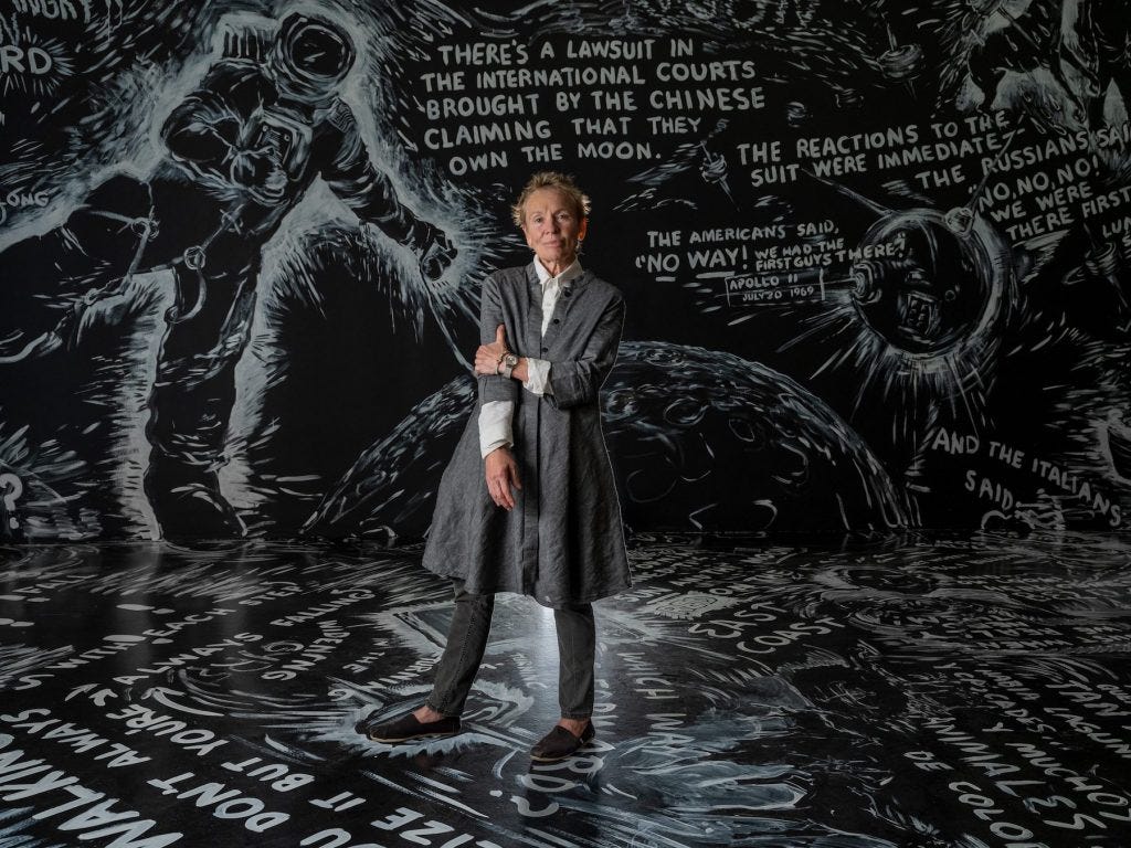 Laurie Anderson stood in her chalk room exhibition 