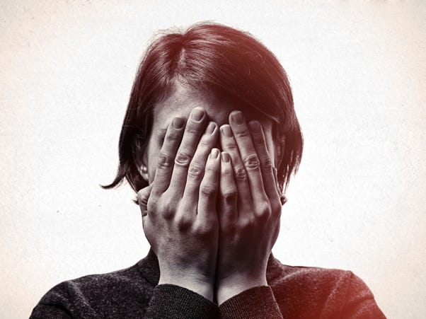 A person covering her face with her hands

AI-generated content may be incorrect.