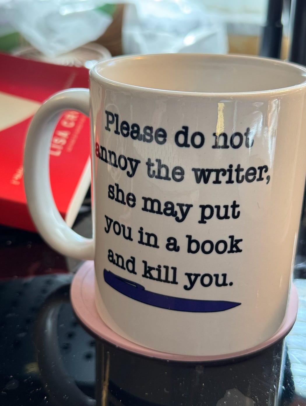 A photo of a mug that says, “Please do not annoy the writer, she may put you in a book and kill you.” These two sentences are improperly connected with a comma splice instead of a period or semicolon.