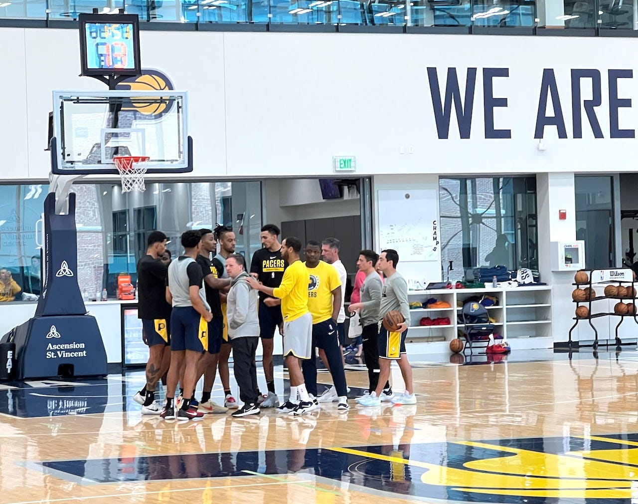 Pacers VP of Player Personnel Ryan Carr breaks down a huddle with prospects after a 2023 pre-draft workout at the St. Vincent Center.