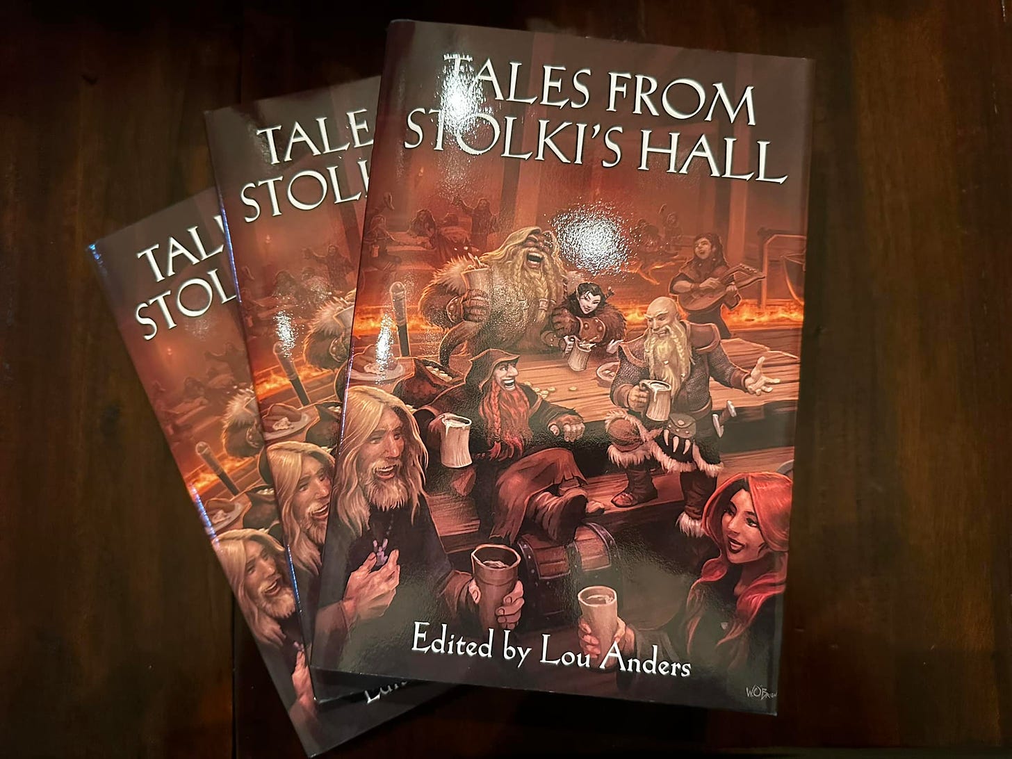 The hardcover of Tales from Stolki's Hall. 3 books in a stack.