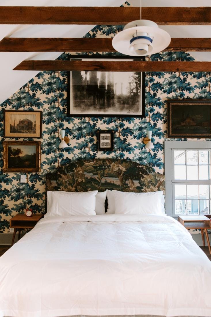 a lush blue and green guest bedroom. 26