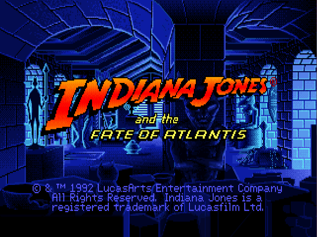 A screenshot of the title screen of Indiana Jones and the Fate of Atlantis, featuring the game's logo, copyright information, and a darkened room in the university's historical archives, which are full of various pieces, books, and more.