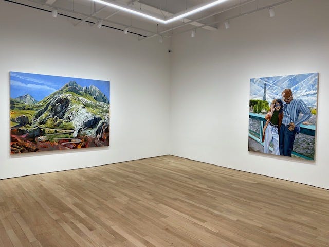 On the left: a painting of a windy road going up a mountain pass, set against a mostly clear blue sky; the same or a similar color scheme repeats in the painting on the right, a larger than life portrai that seems like a snapshot of a couple standing at a bridge, their eyes covered by tinted glasses as they look down at the ground or off in the distance; a nature scene of green, but cloudier skies is in the background