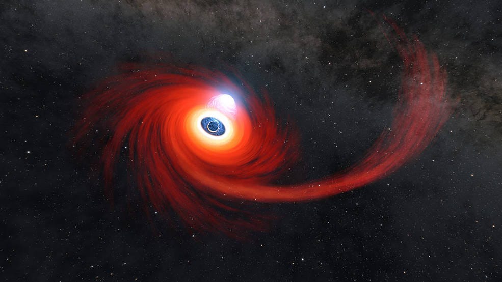 A disk of hot gas swirls around a black hole in this illustration
