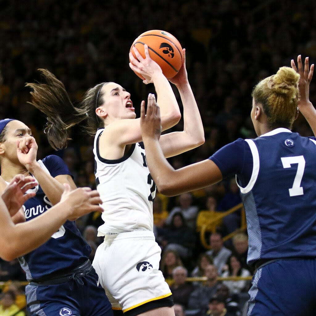 Caitlin Clark of the Iowa Hawkeyes going up for a shot.