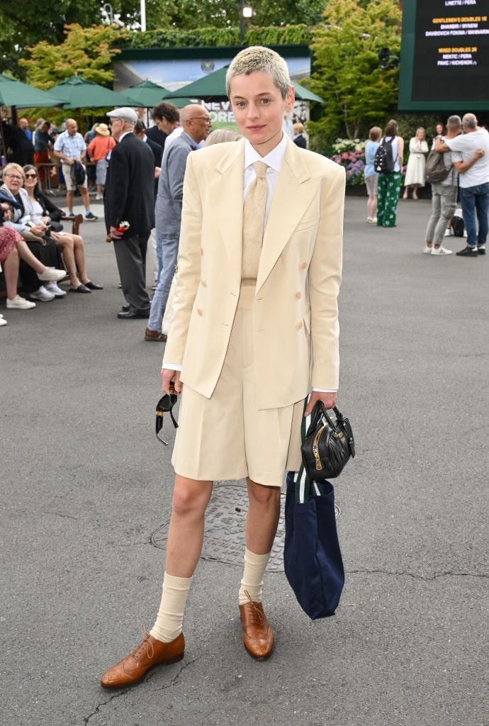 Emma Corrin in a short suit at Wimbledon celebrity spotting.
