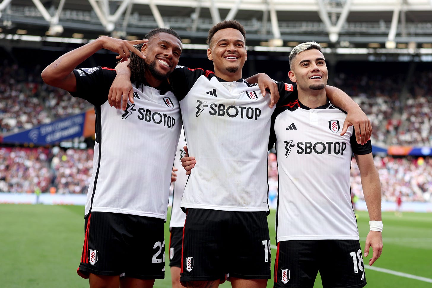 Alex Iwobi, Rodrigo Muniz and Andreas Pereira pose for the camera after Fulham's second goal at West Ham.