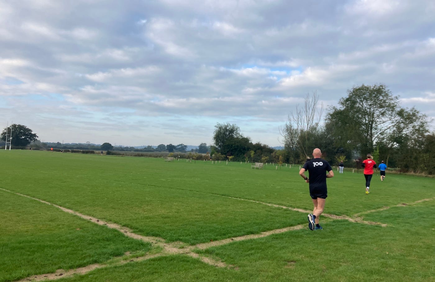 A line of runners in a field