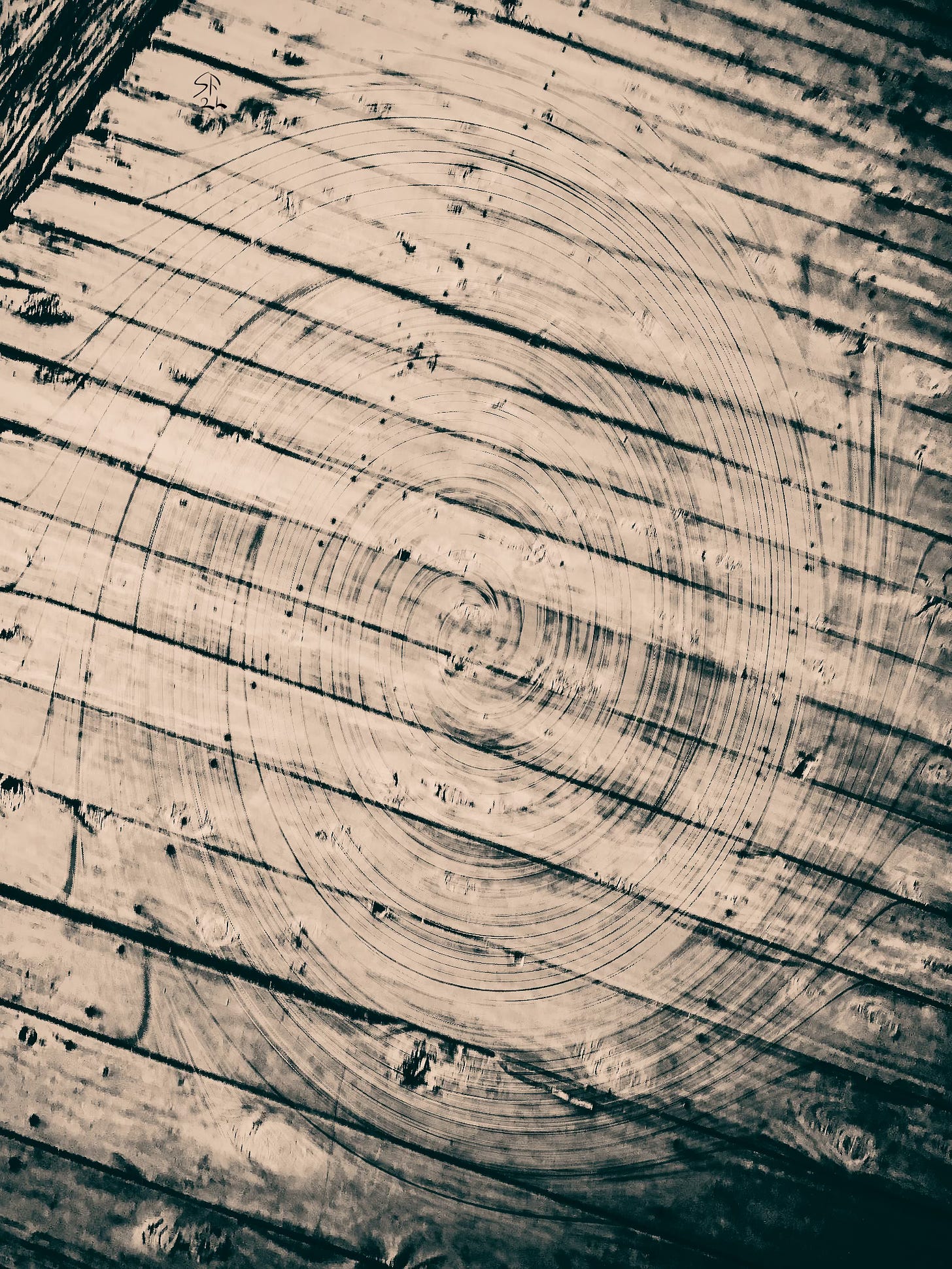 Black-and-white photo of old timber floor, a swirling vortex superimposed