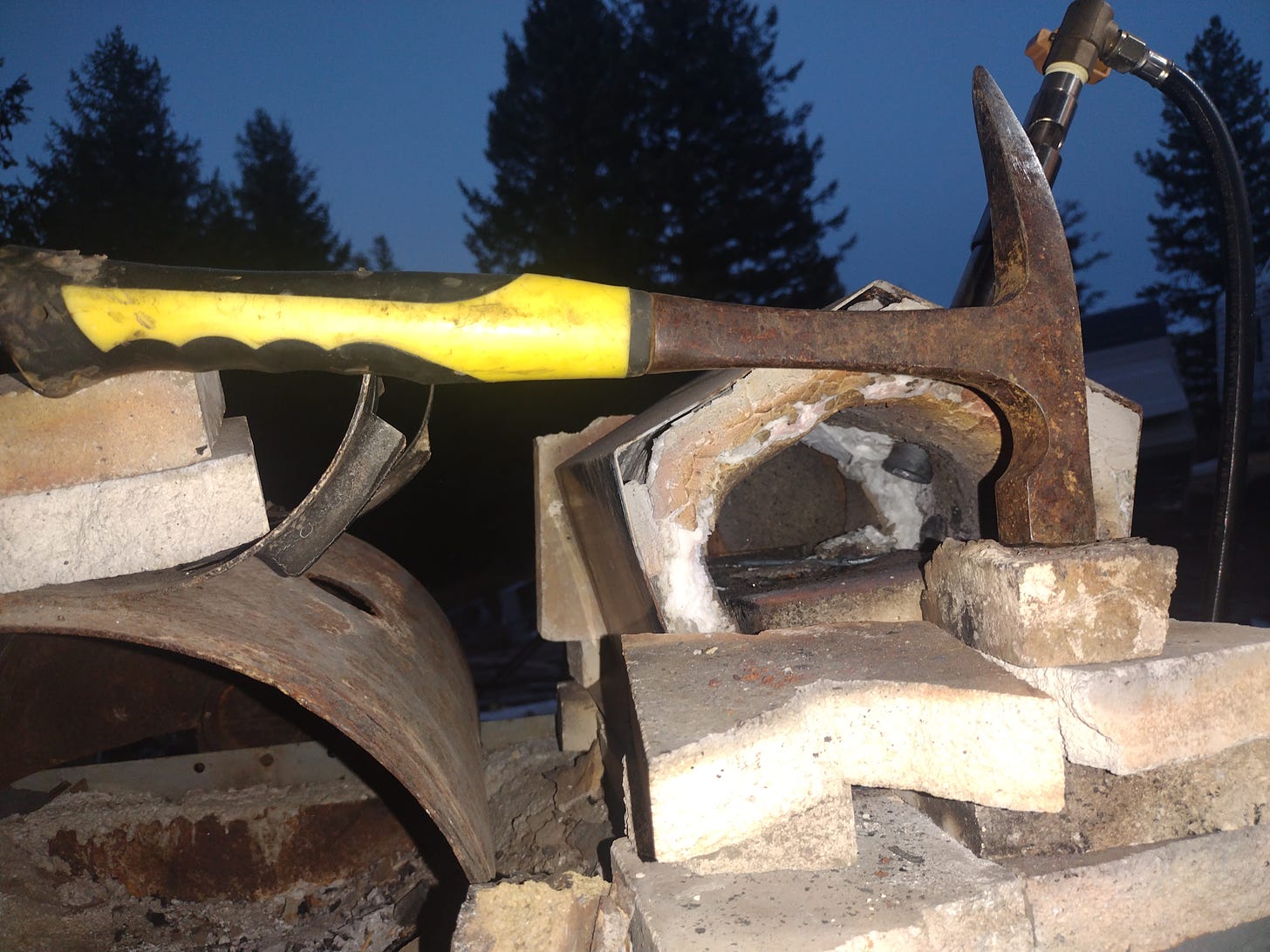 A rock hammer on a forge