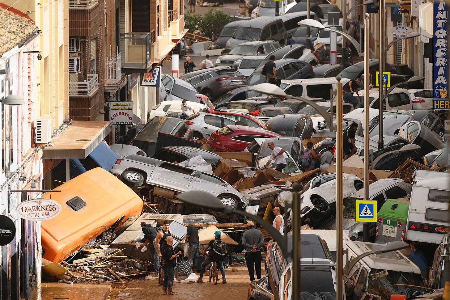 Cars are seen piled in the street in the Sedaví area of Valencia on Wednesday.