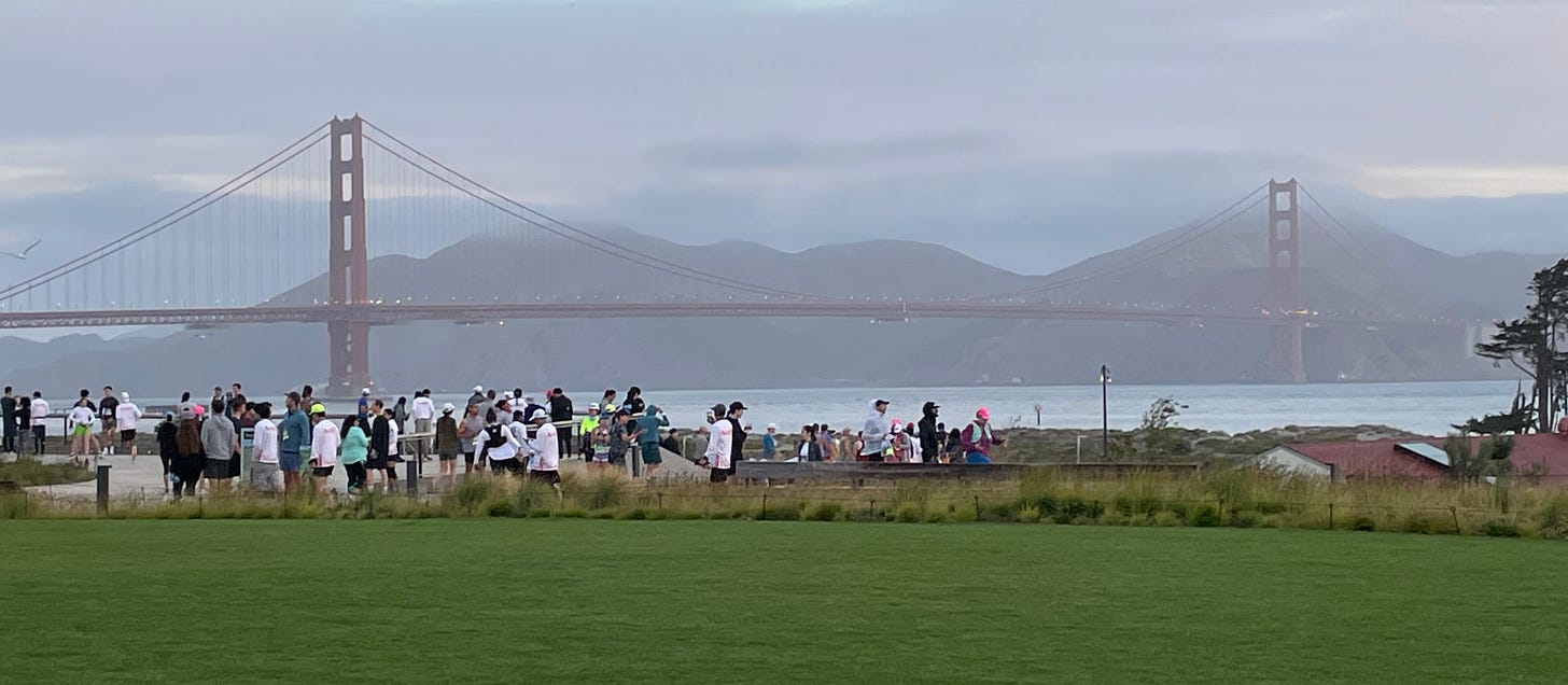 Runners gather for San Francisco First Half Marathon at Crissy Field near to Golden Gate Bridge