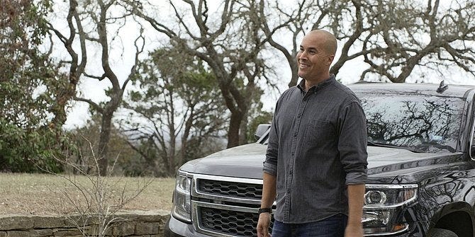 Walker James smiling outside truck at Jared Padalecki.